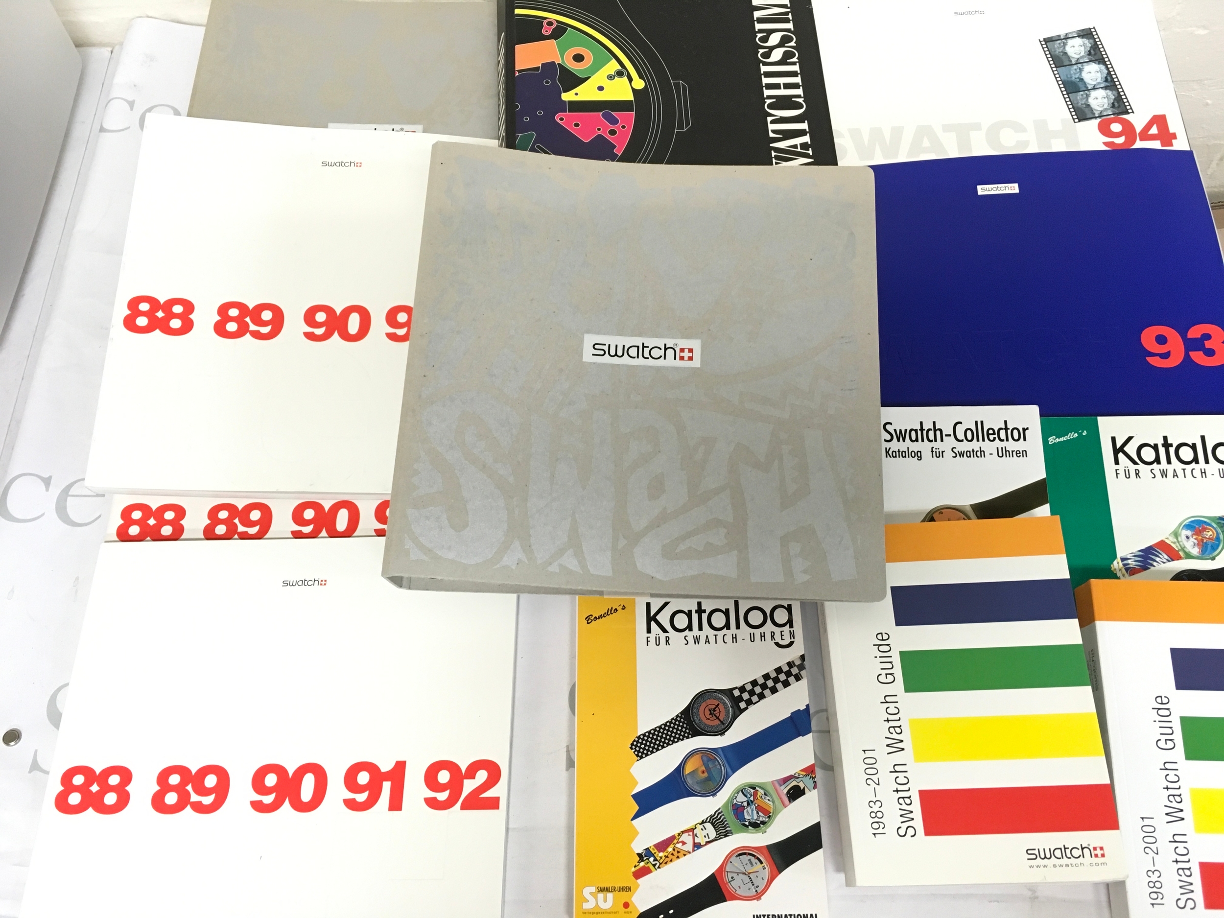 A collection of assorted swatch books and reference catalogs.
