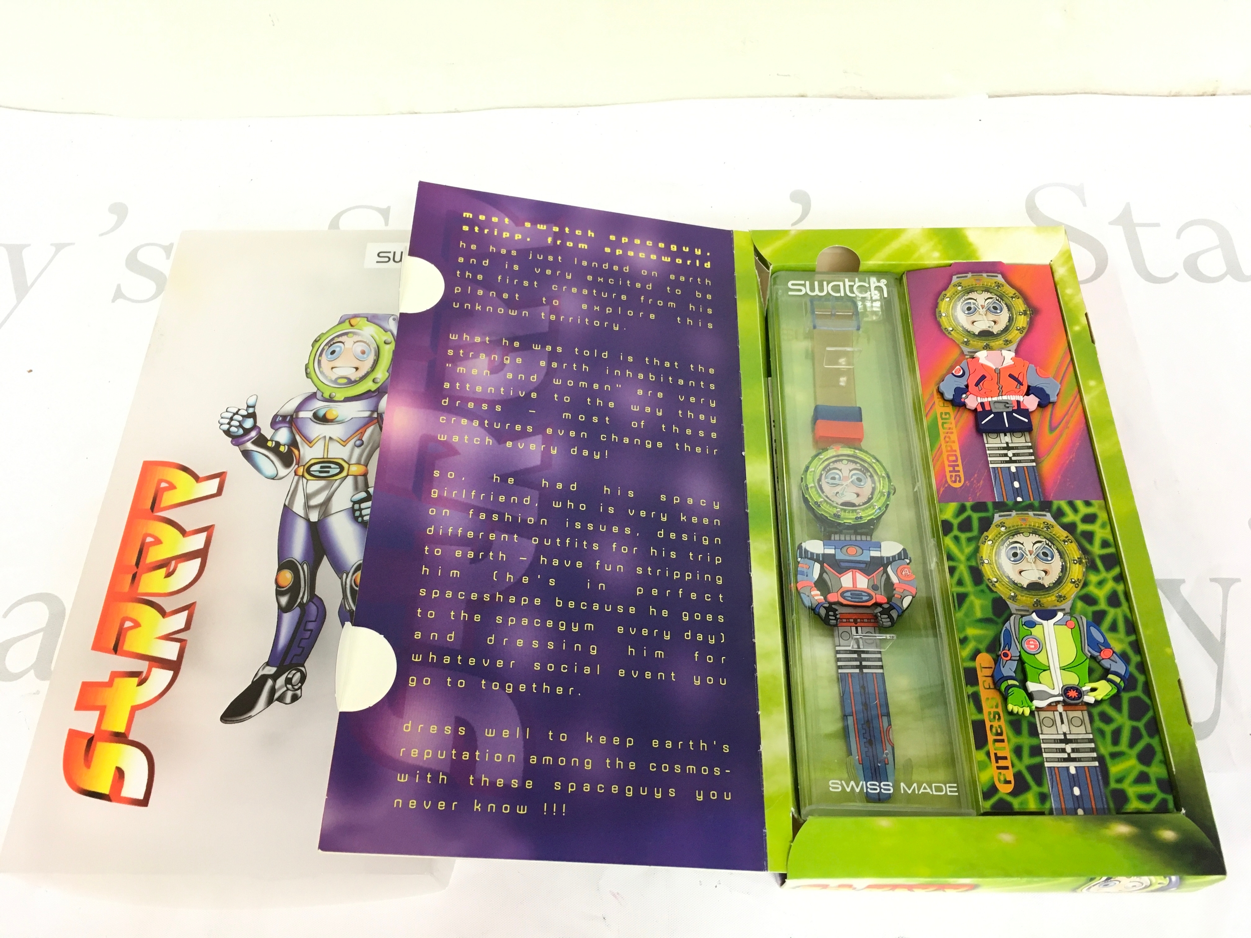 1996 Swatch Scuba 200 "Stripp" (SDN120) watch set, featuring interchangeable strap accessories. The set includes the main watch and three additional "clothes" or strap covers that allow for customisation.