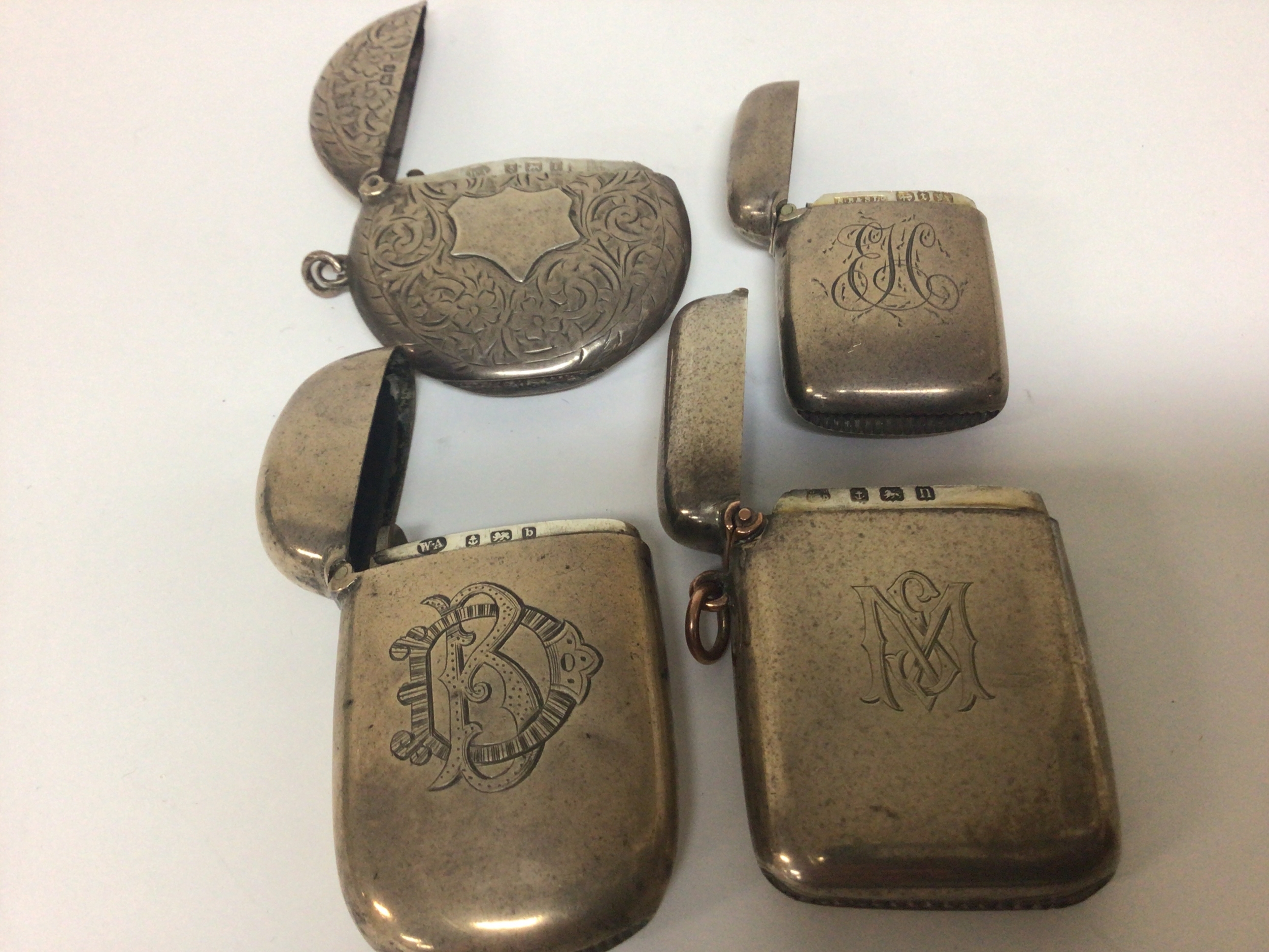  Four Silver Vesta cases of various designs Birmingham hallmarks mixed dates. Weight 85g 