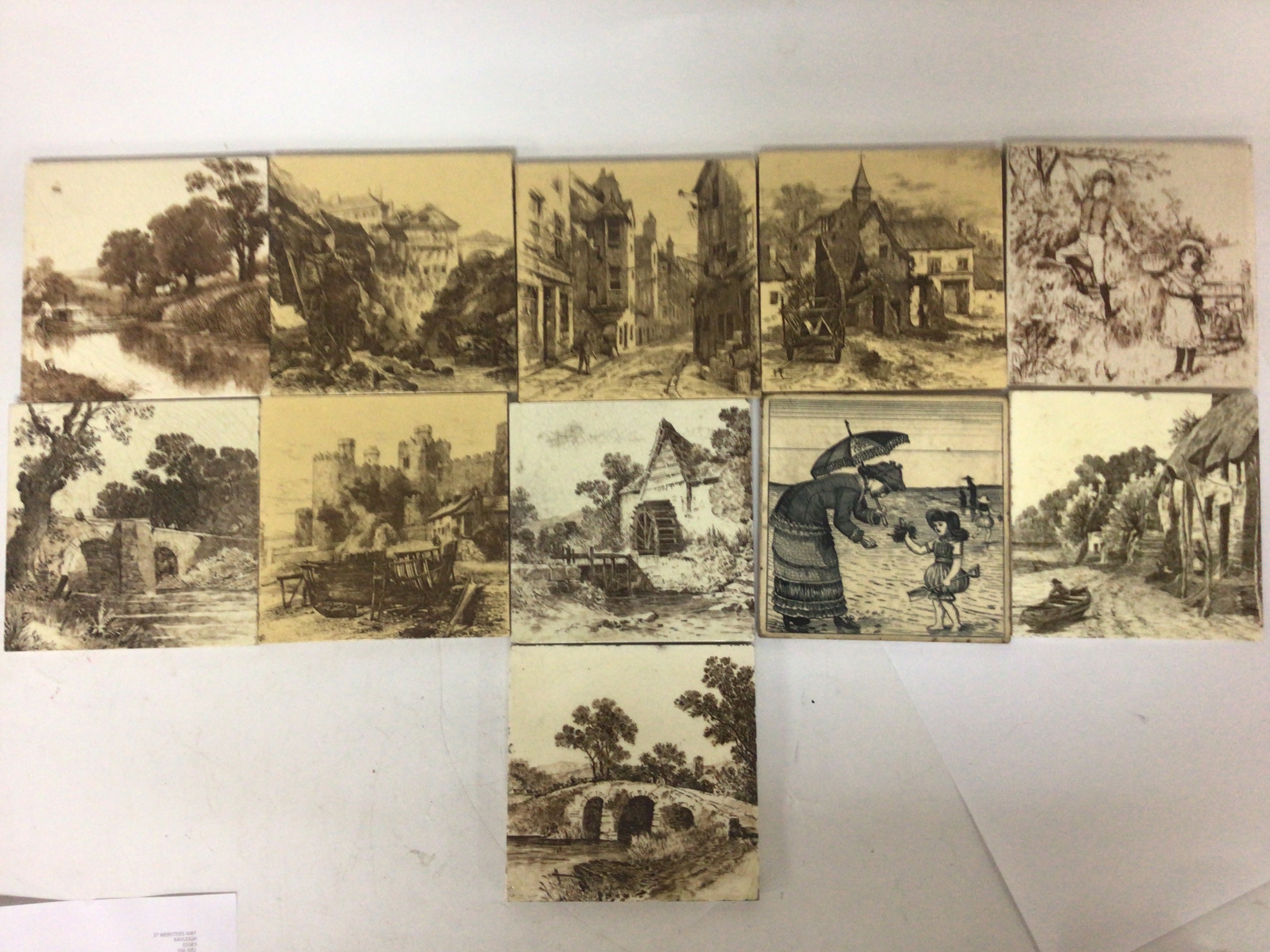  A collection of quality Victorian Minton and other ceramic tiles decorated with Victorian views rural and street town scenes good condition in keeping with age (11) 