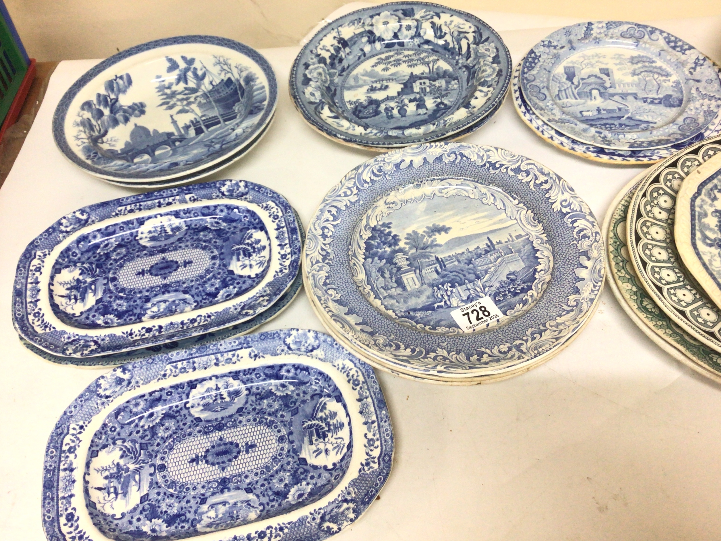  A collection of Victorian blue and white bowls and dishes decorated with mixed patterns including Neo-Classical views oriental scenes landscape views with monuments and others. Including Spode Copeland & Garrett 