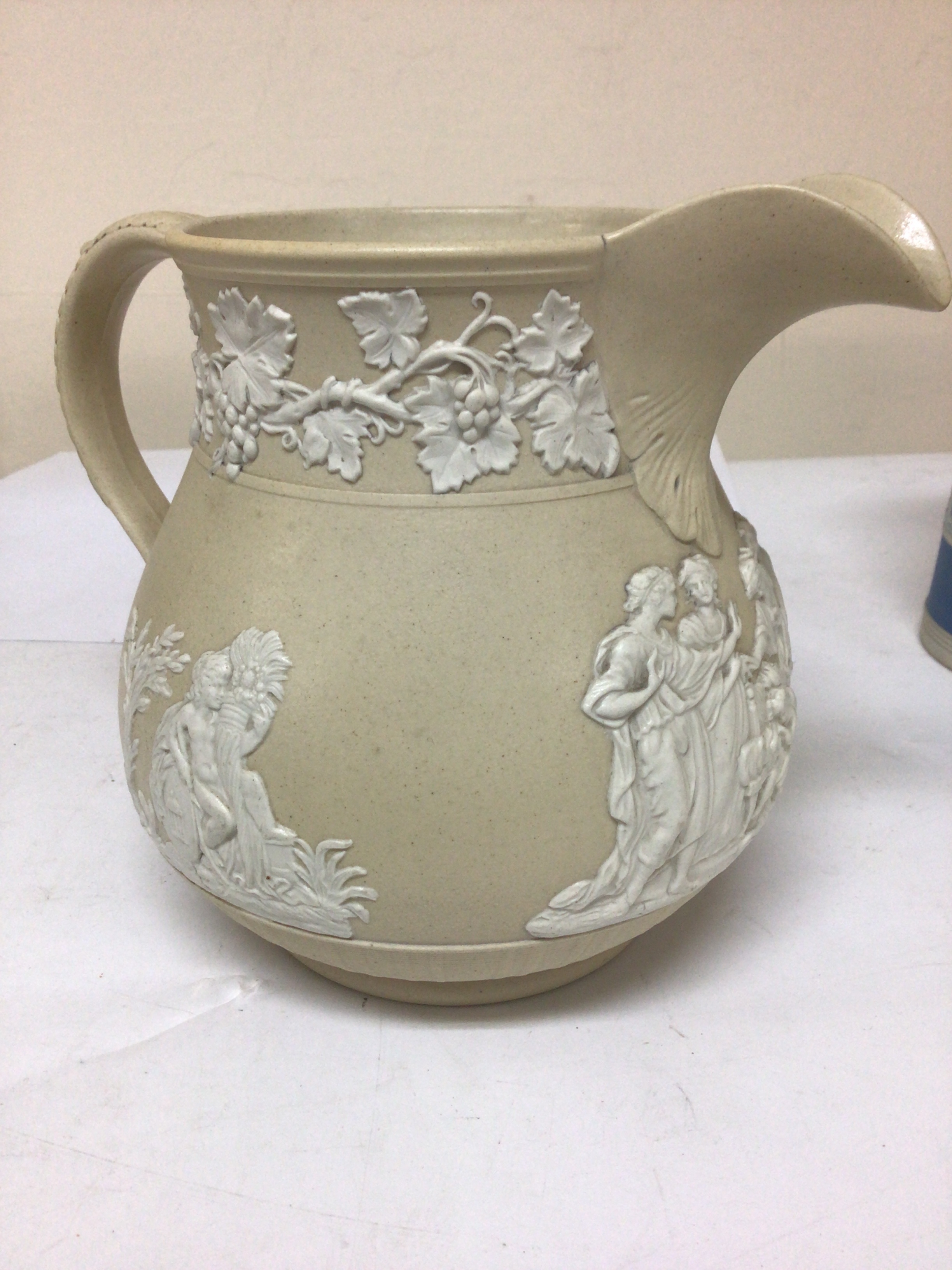   A rare English early 19th century 1810-1830 pitcher ceramic jugs meat plate sprig decorated with Neo- classical figures the handle with stylised acanthus leaves the lower section of the jug with simulated basket weave. with rare Chrysanthemum pad mark and numbered. No obvious damage except firing crack.and hairline crack to rim edge  Hight 18cm. 