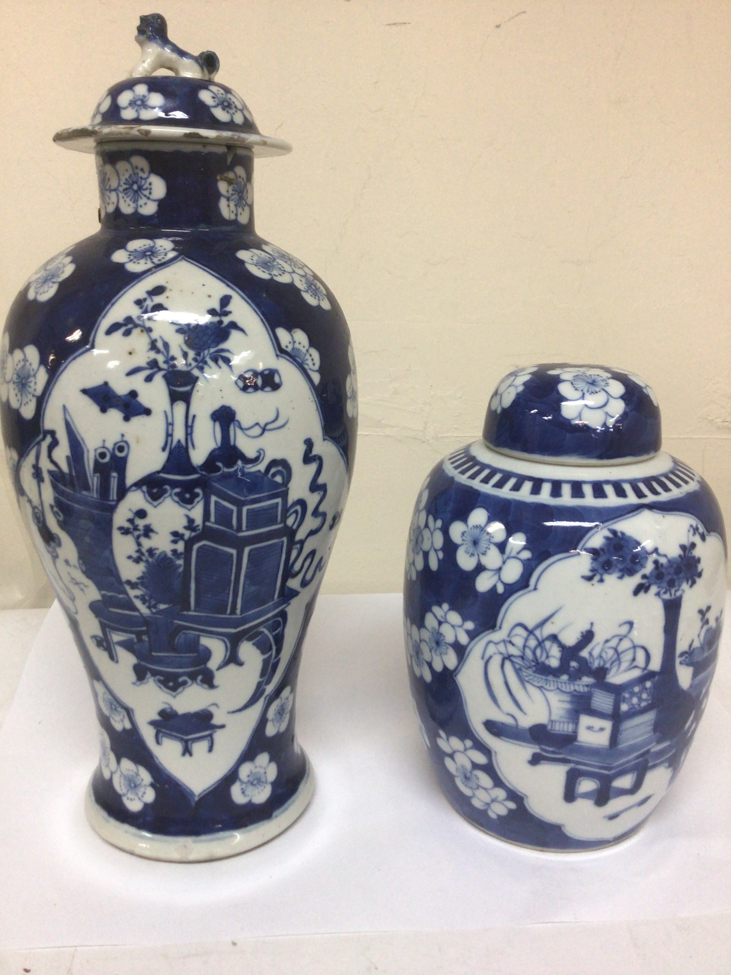  A Chinese Export porcelain blue and white jar and cover the base with Kangxi marks but possibly of a later period and one other export porcelain jar and cover damage to the rim maximum height 37cm. (2) 