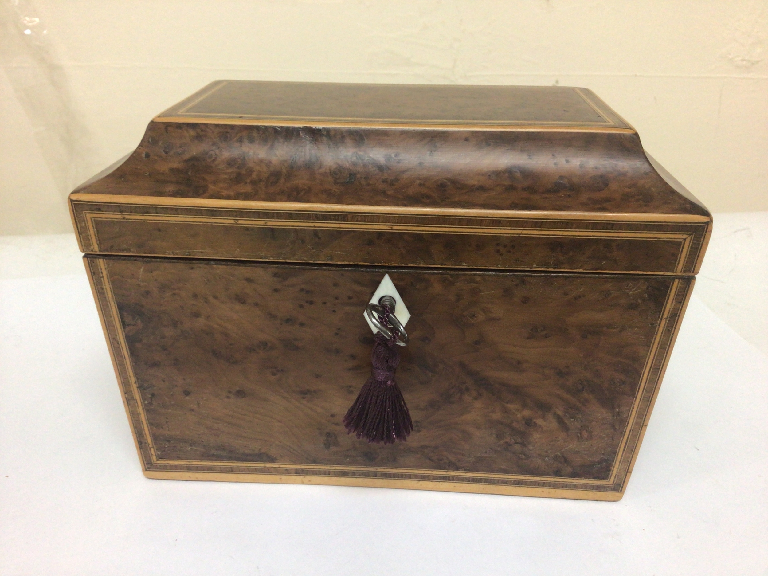 A late George III burr walnut and box wood inlaid two section tea caddy. Height 14cm width 20cm. 