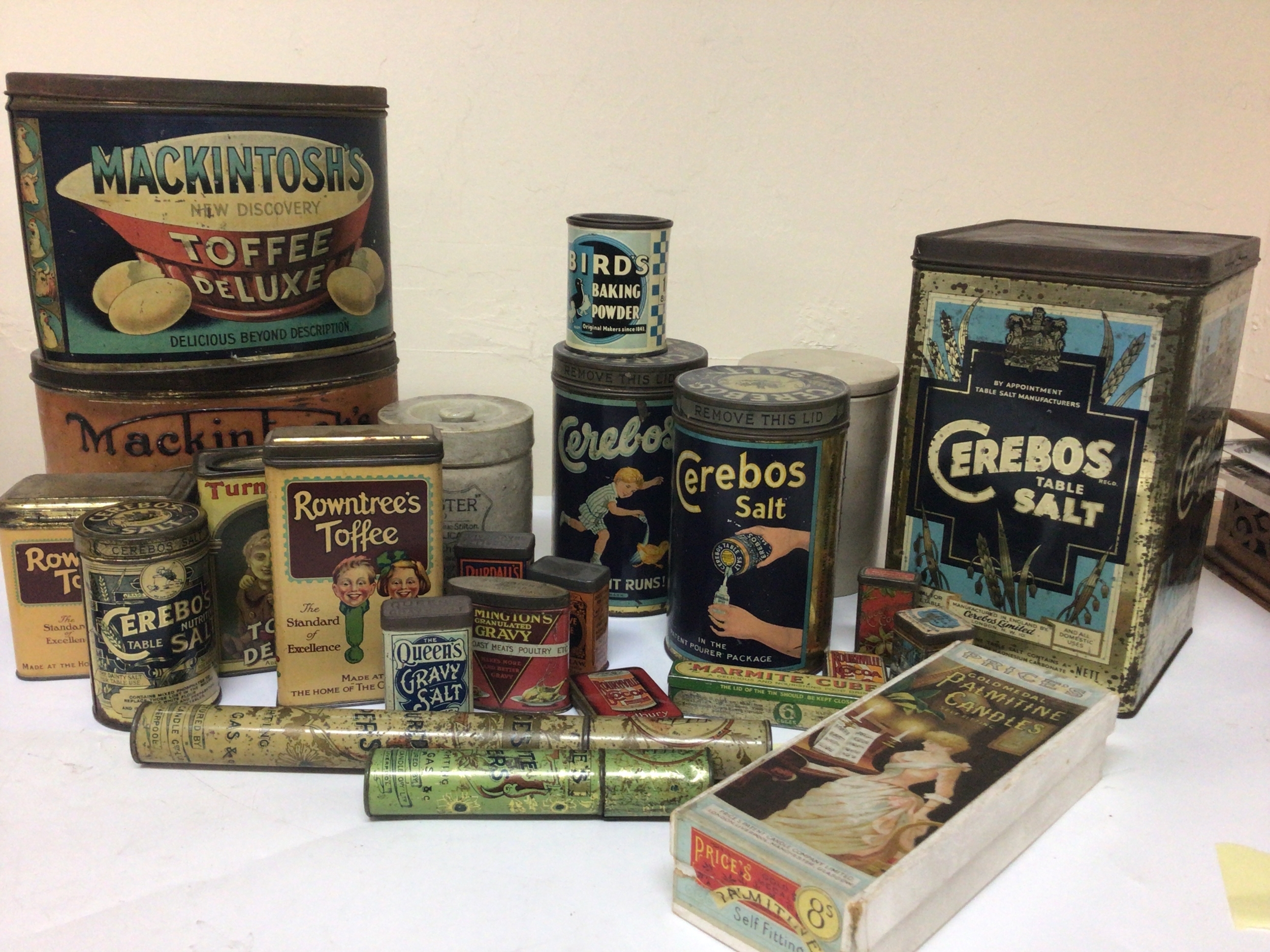  A box containing Vintage kitchen tins Toffee tins ceramic jars and covers oak biscuit barrels and a silver plated biscuit barrel 