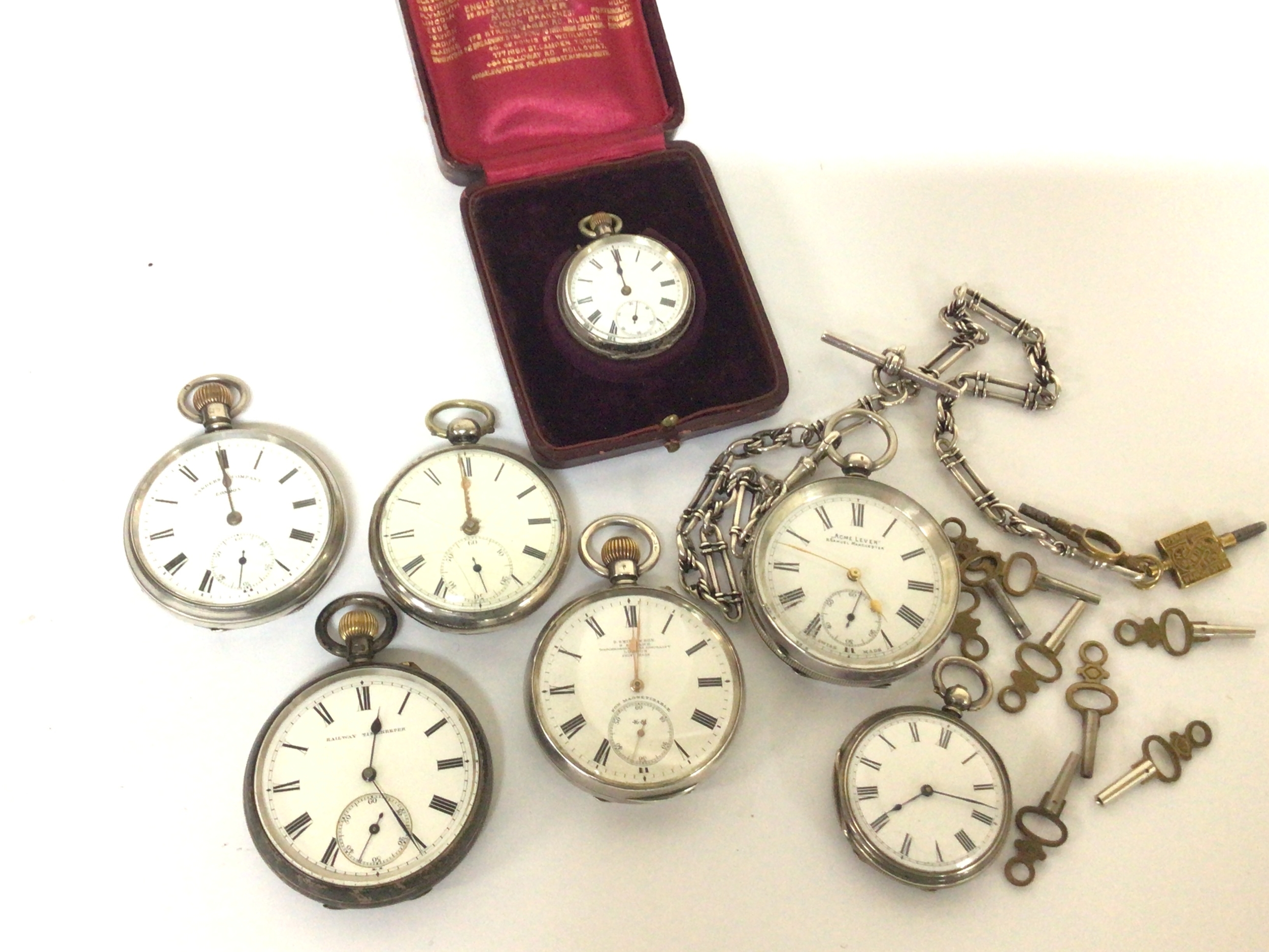  A collection of silver cased open faced keywind pocket watches with keys including one watch chain and one watch in a fitted case. 