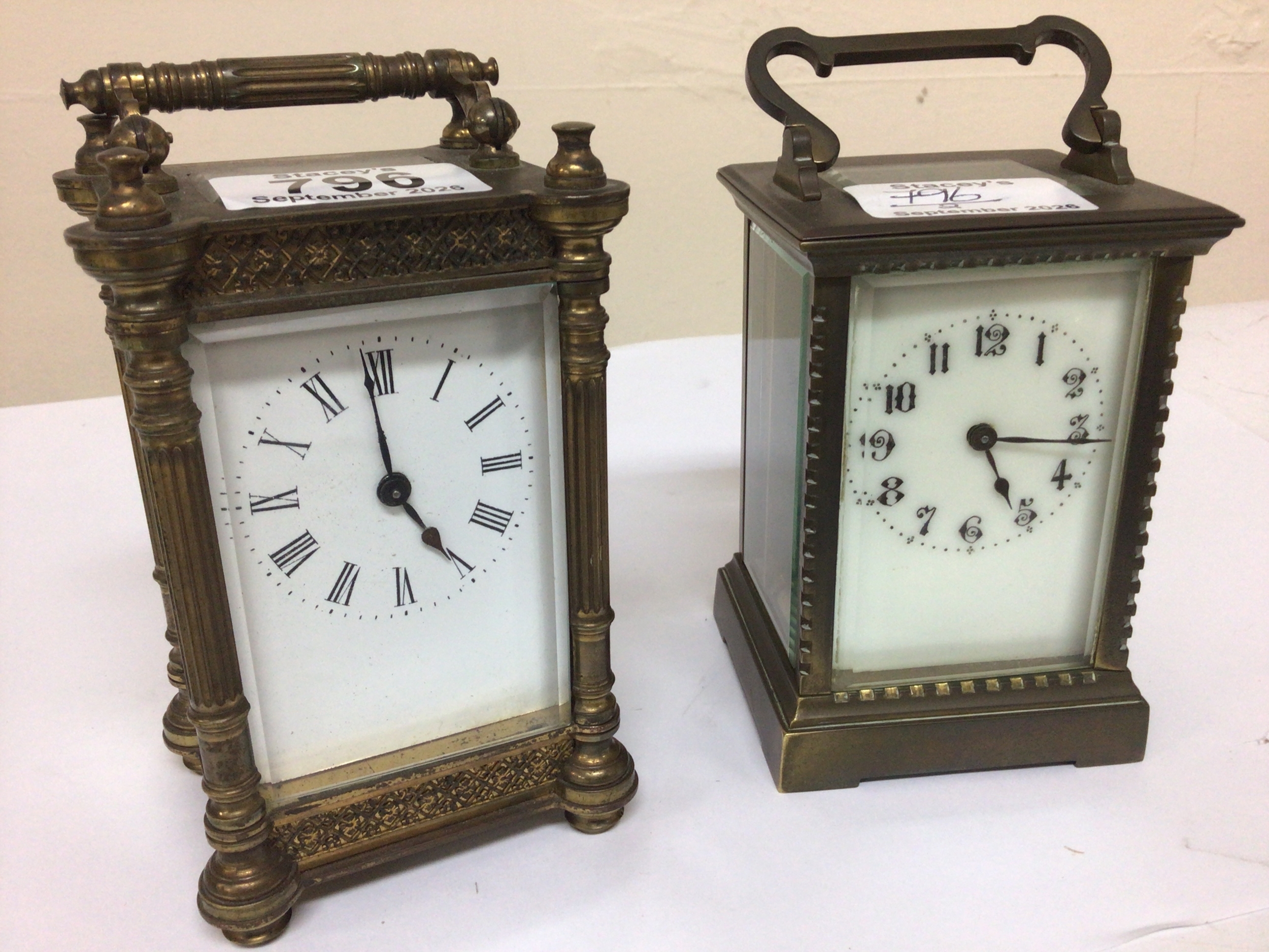  Two brass cased carriage clocks one with pillar supports with key and seen working and one other carriage clock (2) 