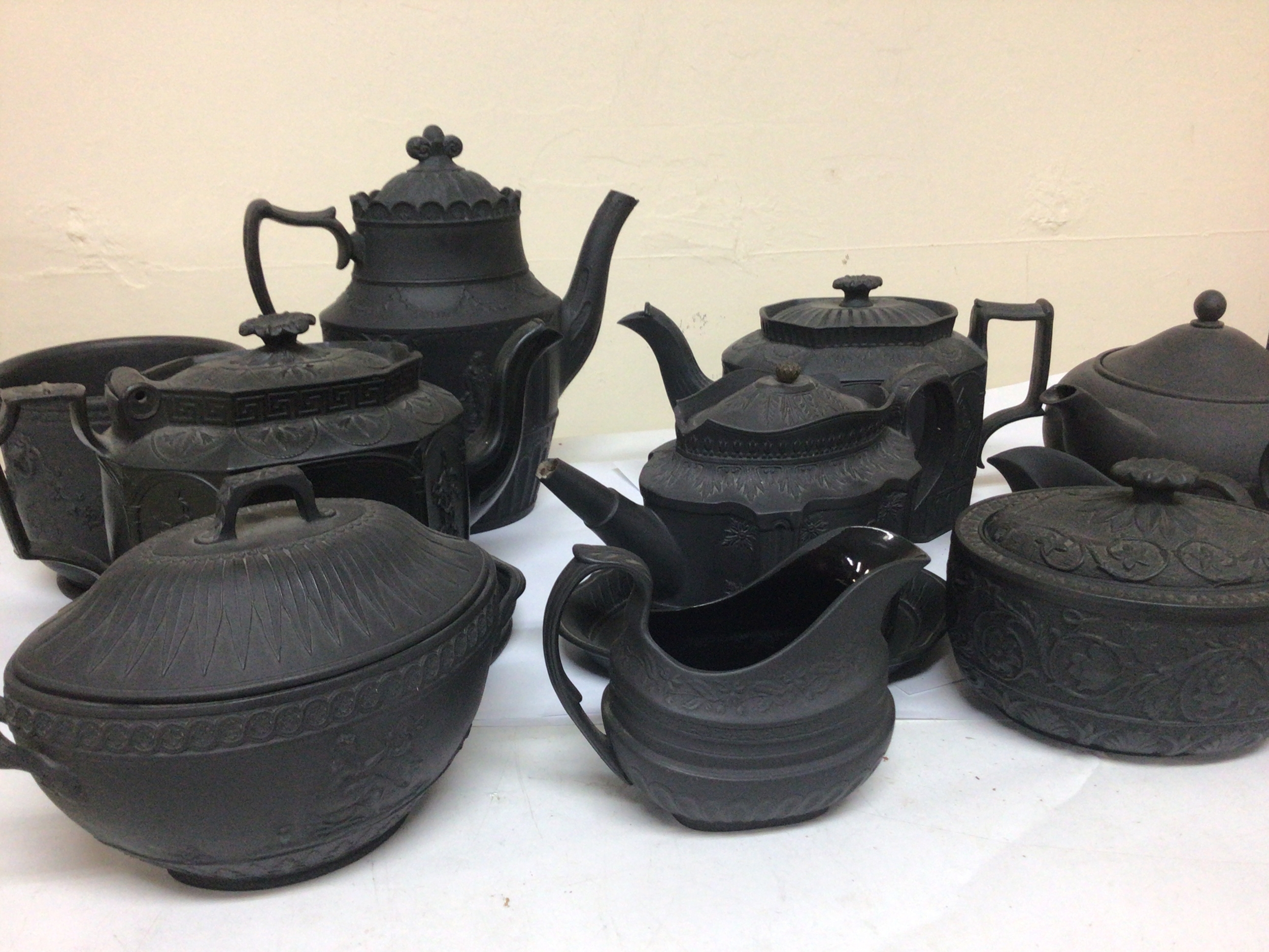  A collection of 19th century and later Wedgwood and other black basalt ware of Regency and Neo classical design some marked Wedgwood. Most in very good condition. 