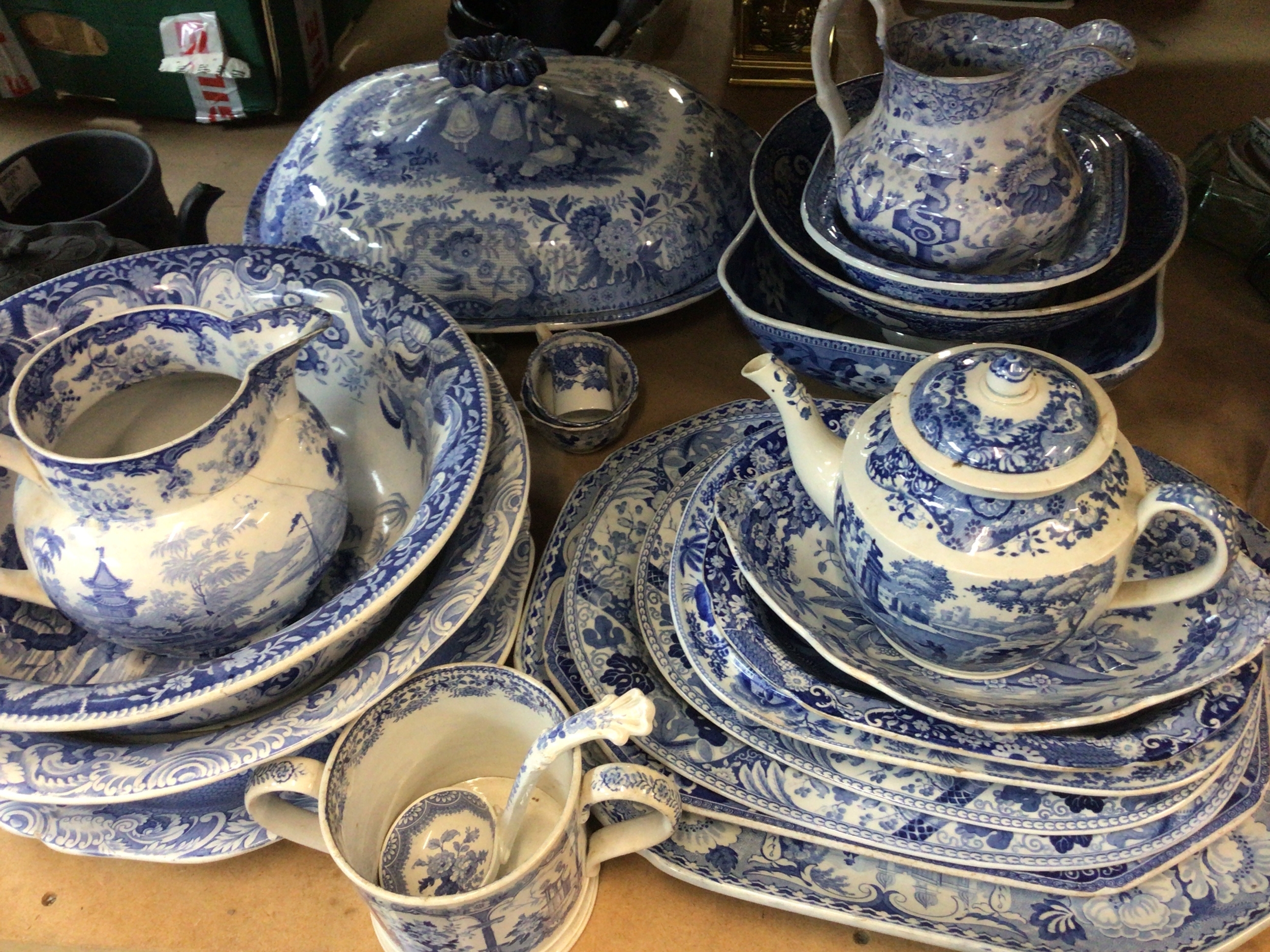  A collection of Victorian blue and white ceramics large tureen's with covers jugs and meat plates. A few with cracks but mostly in good condition in keeping with age. 