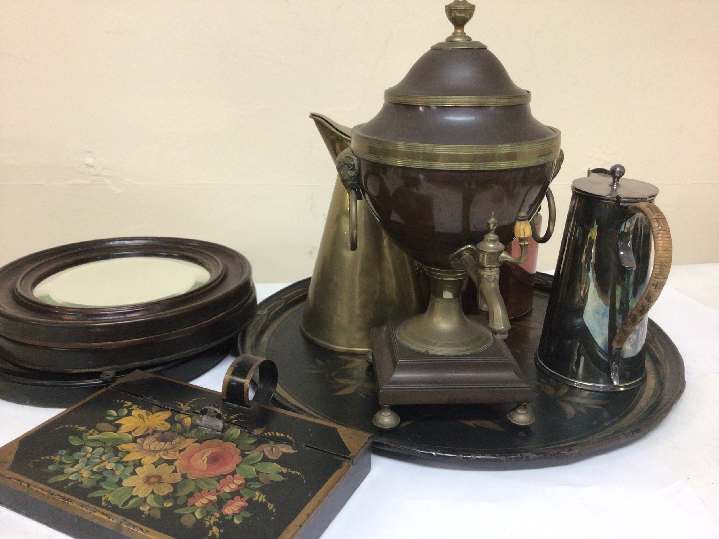  A late Regency copper and brass samovar other brass and copper ware three small round mirrors and painted tin. 