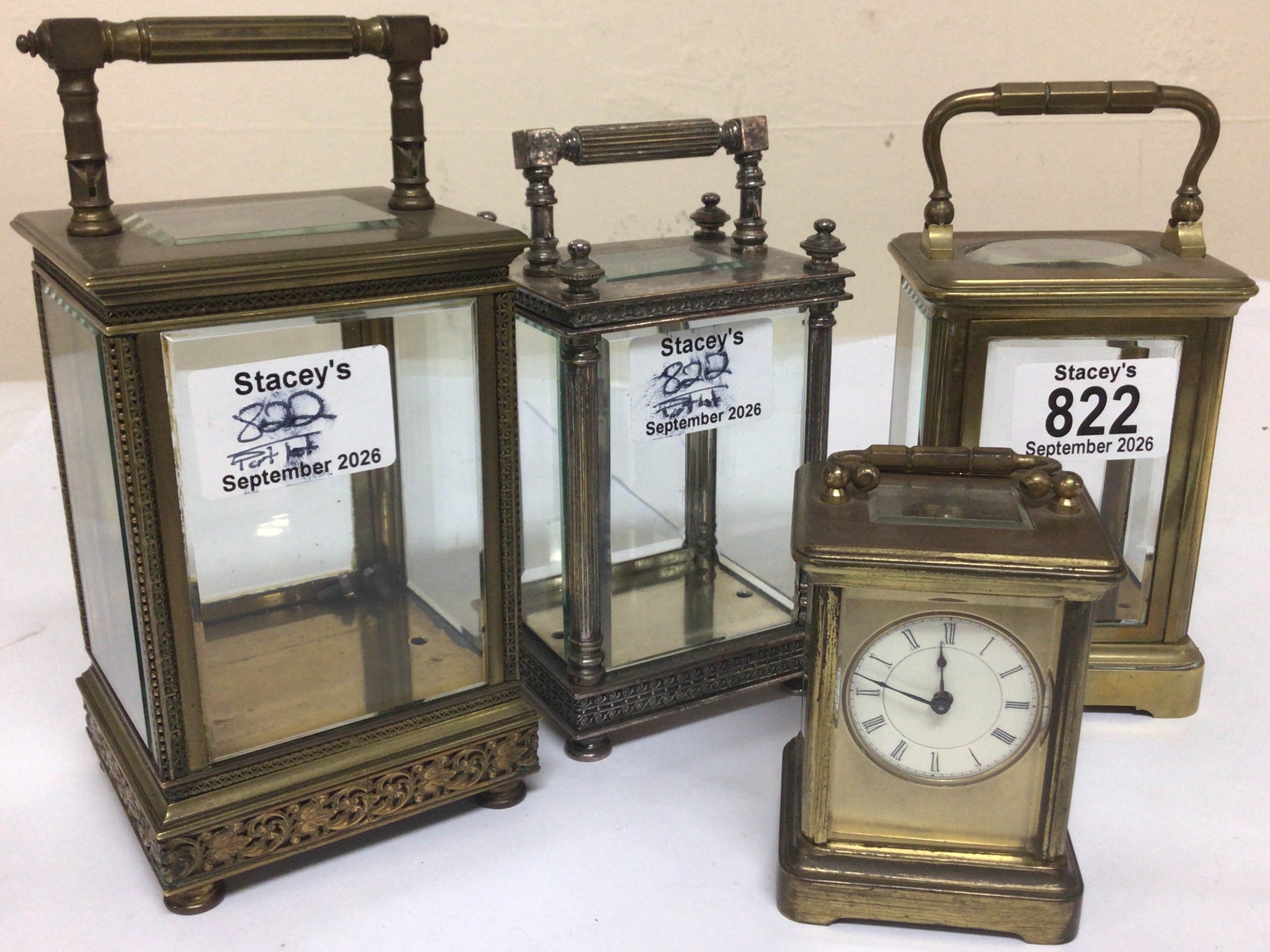  A miniature brass cased carriage clock and a quantity of carriage clock cases. 
