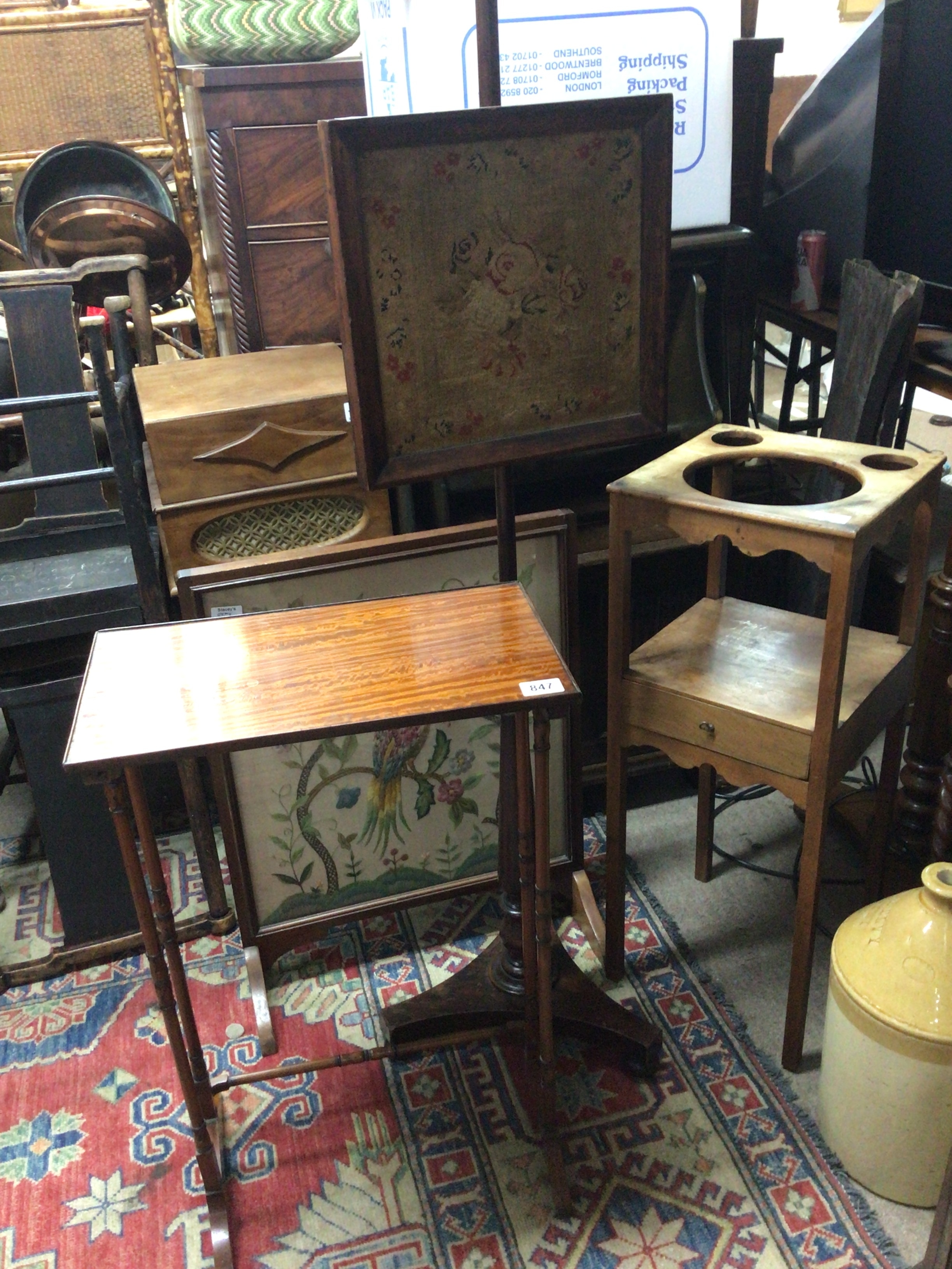 A William V rosewood face fire guard with tapestry panel a satinwood table George III mahogany washstand and an embroidered fire screen (4) 
