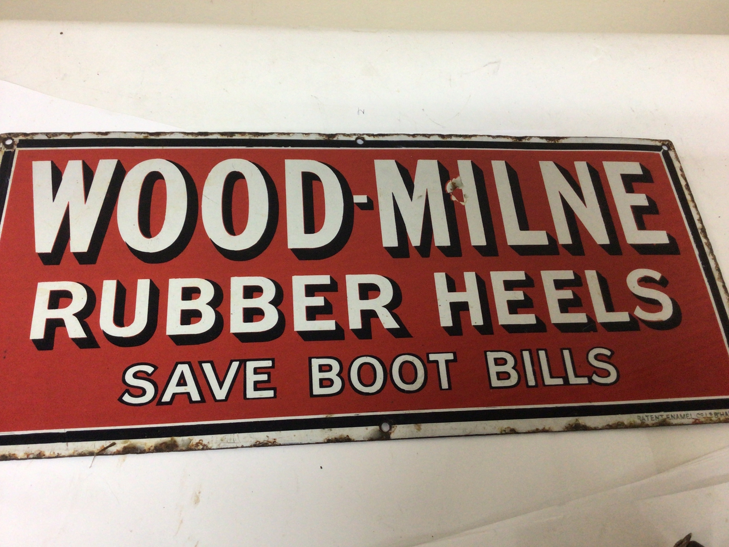  A vintage enamel sign Wood - Miline Rubber Heels Save on Boot Bills. 51x23cm 