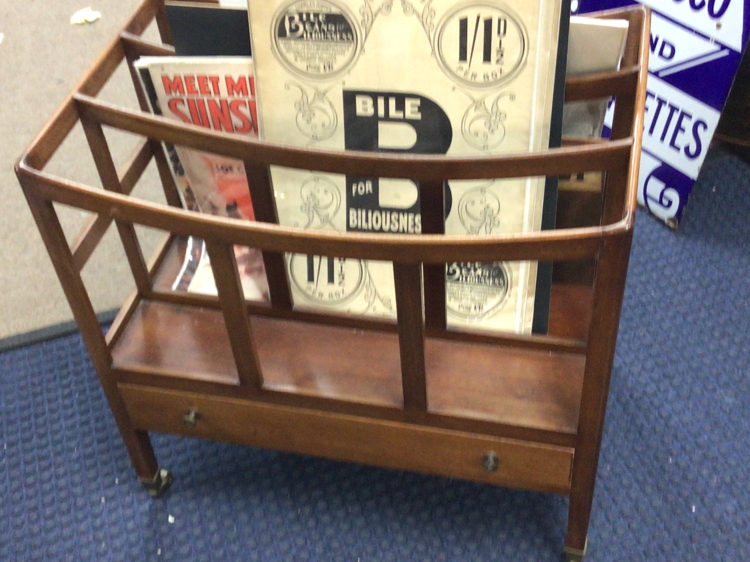  A Mahogany Canterbury magazine rack with a single drawer. 