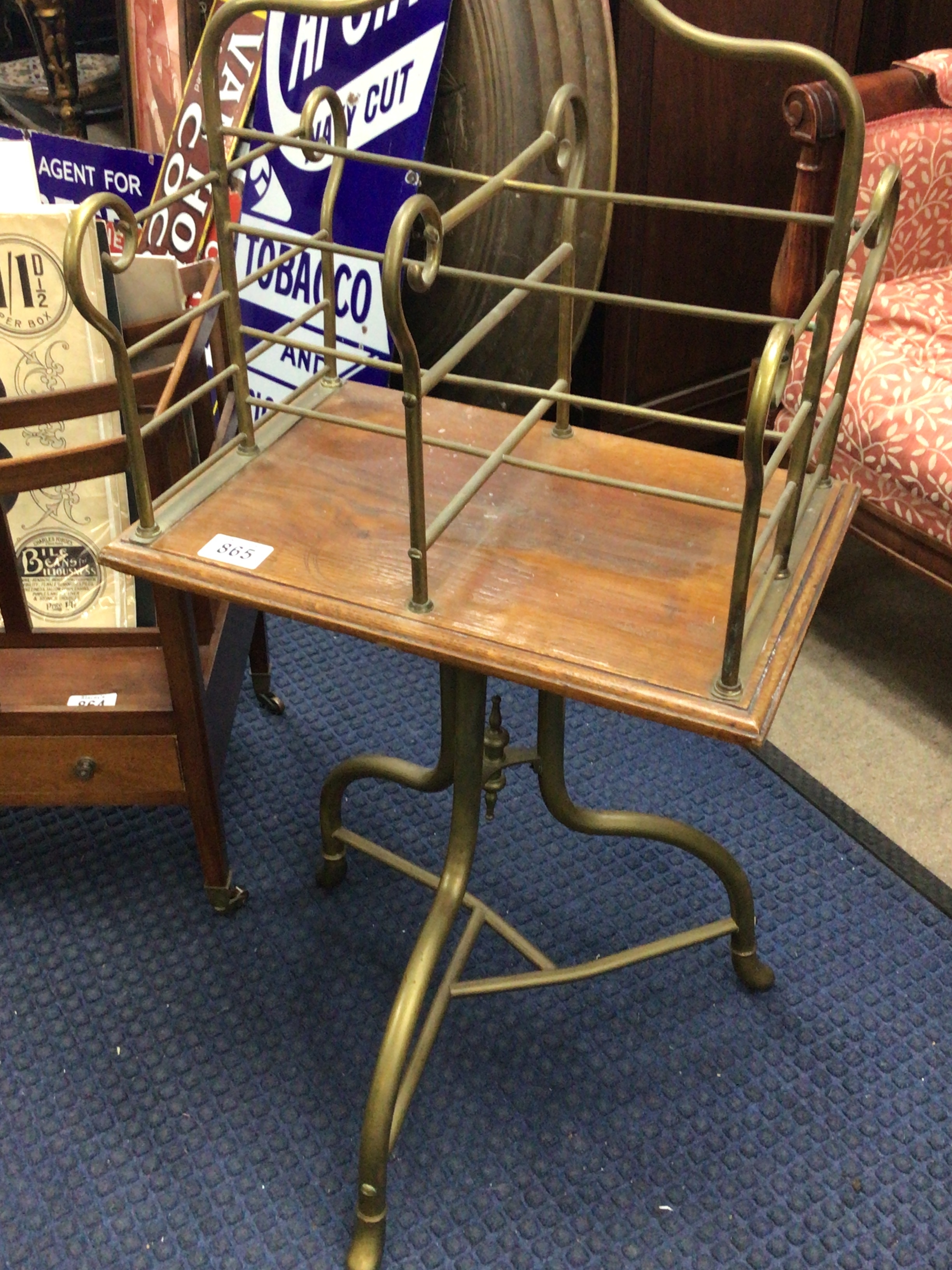  An Early 20th century brass and oak open music sheet or magazine rack with a revolving top section. 