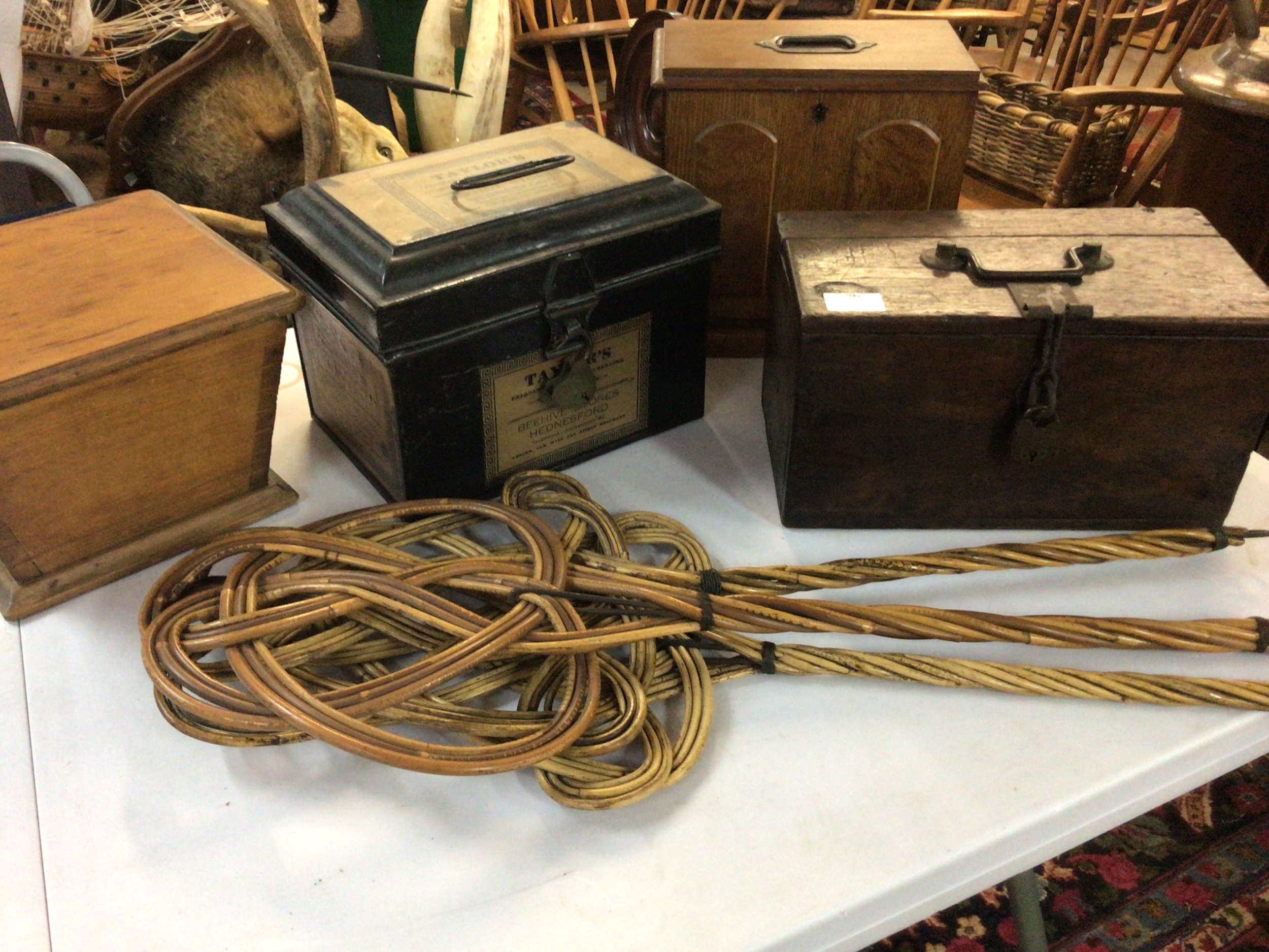 A Victorian Taylor's tin small stationary box other Antique boxes and three carpet beaters. 