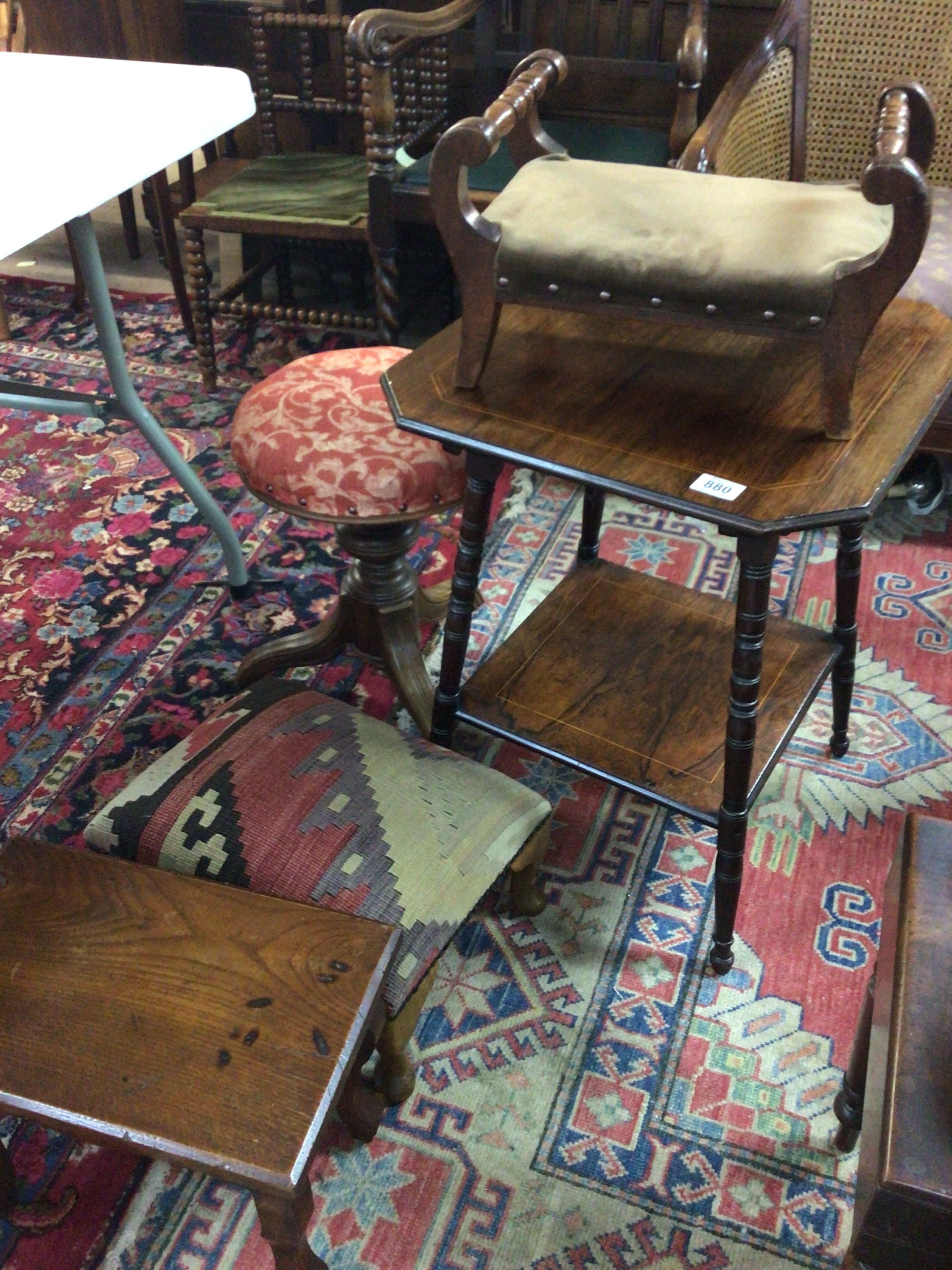  A Victorian rosewood occasional table a music stool with revolving seat and three small stools 