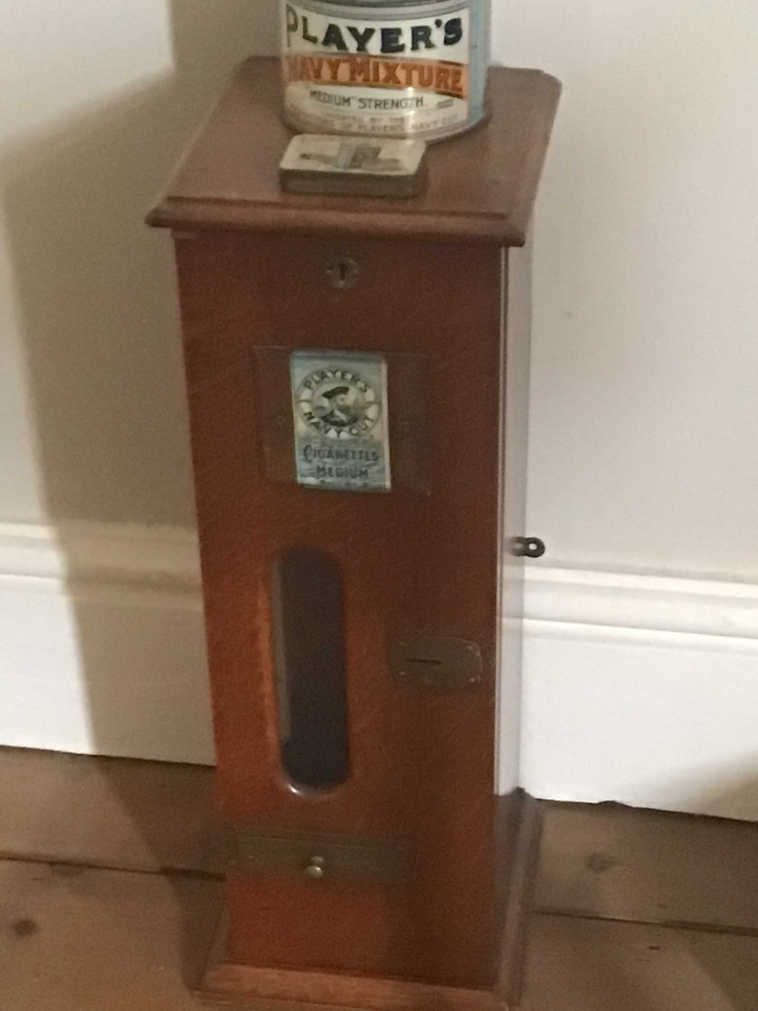  A Vintage Players wall mounting Cigarette dispenser. 