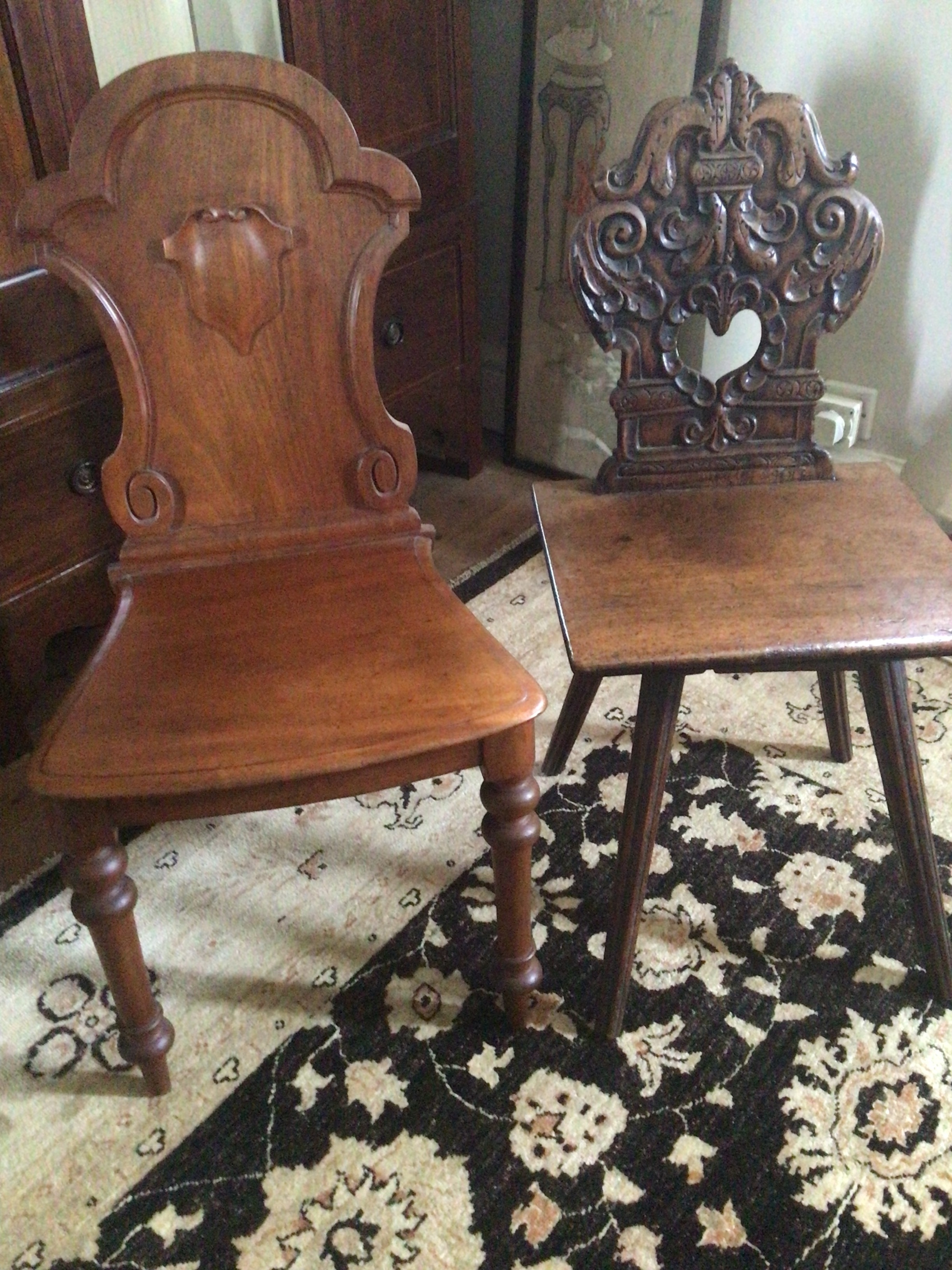  A 19th century Continental carved hall chair  and one other hall chair (2) 