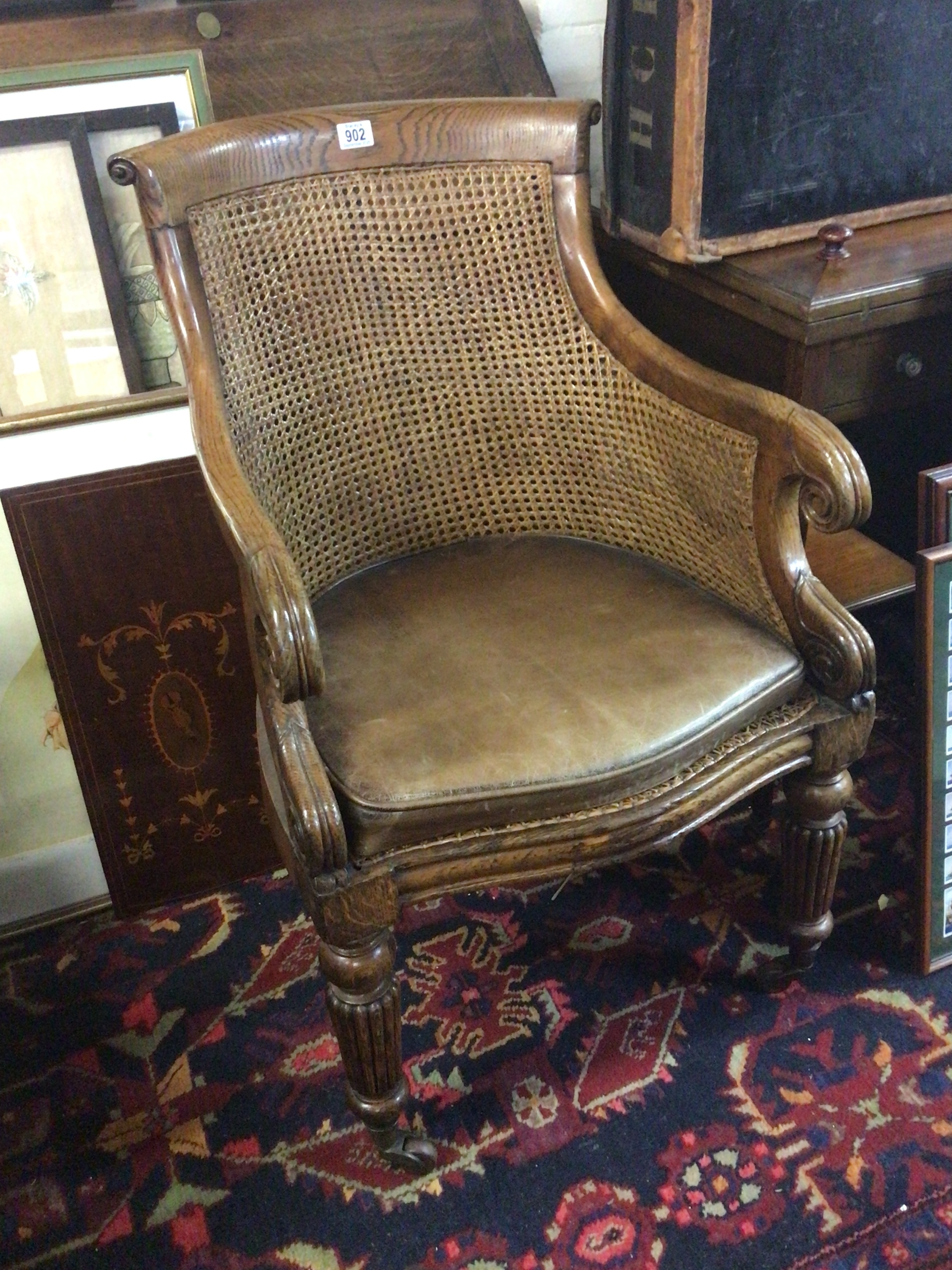   A good example of a William IV Oak Library chair with a Bergere back chair. and a drop in leather seat. 
 