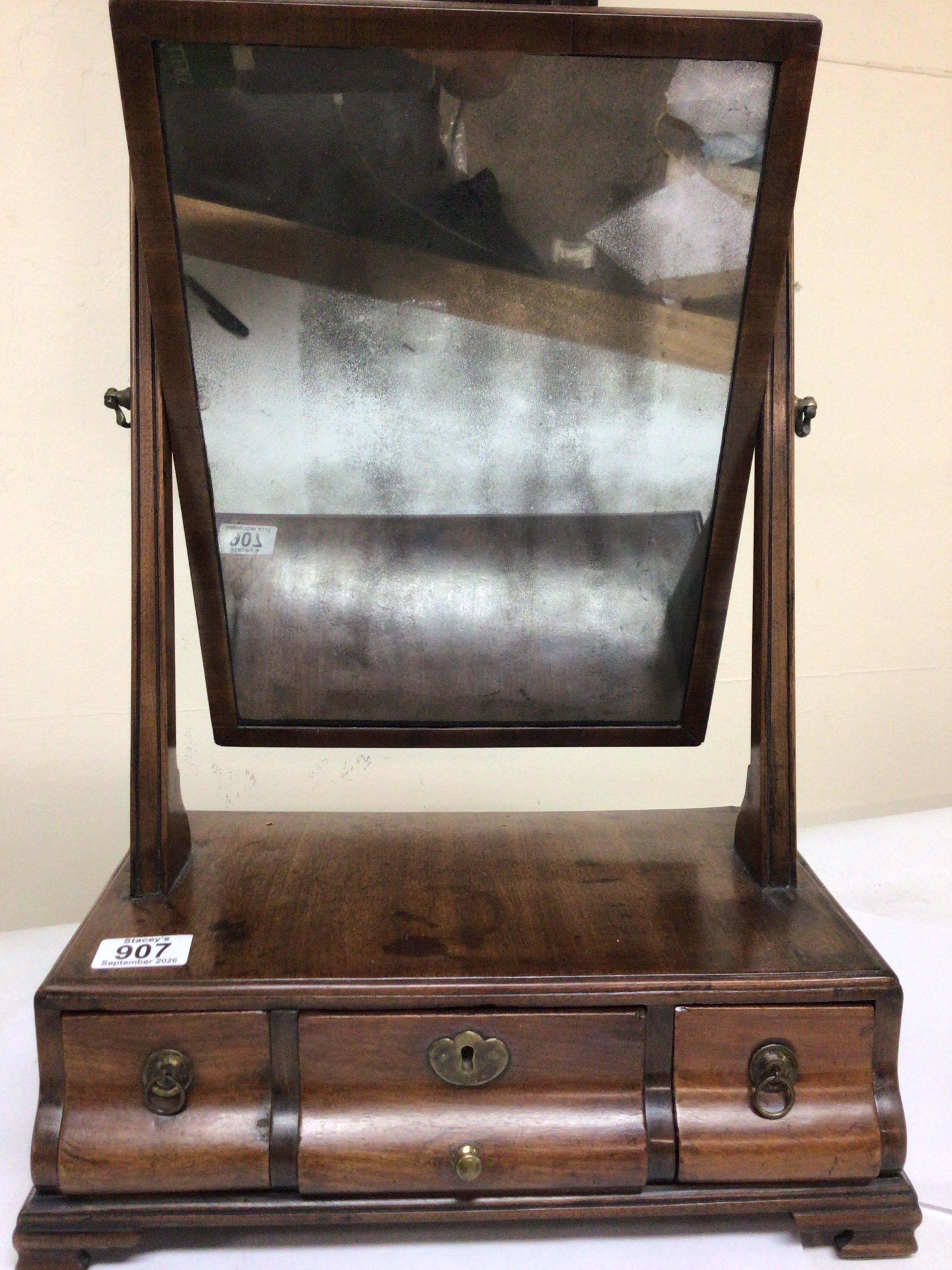  A George III mahogany dressing table mirror with three cushion drawers. 