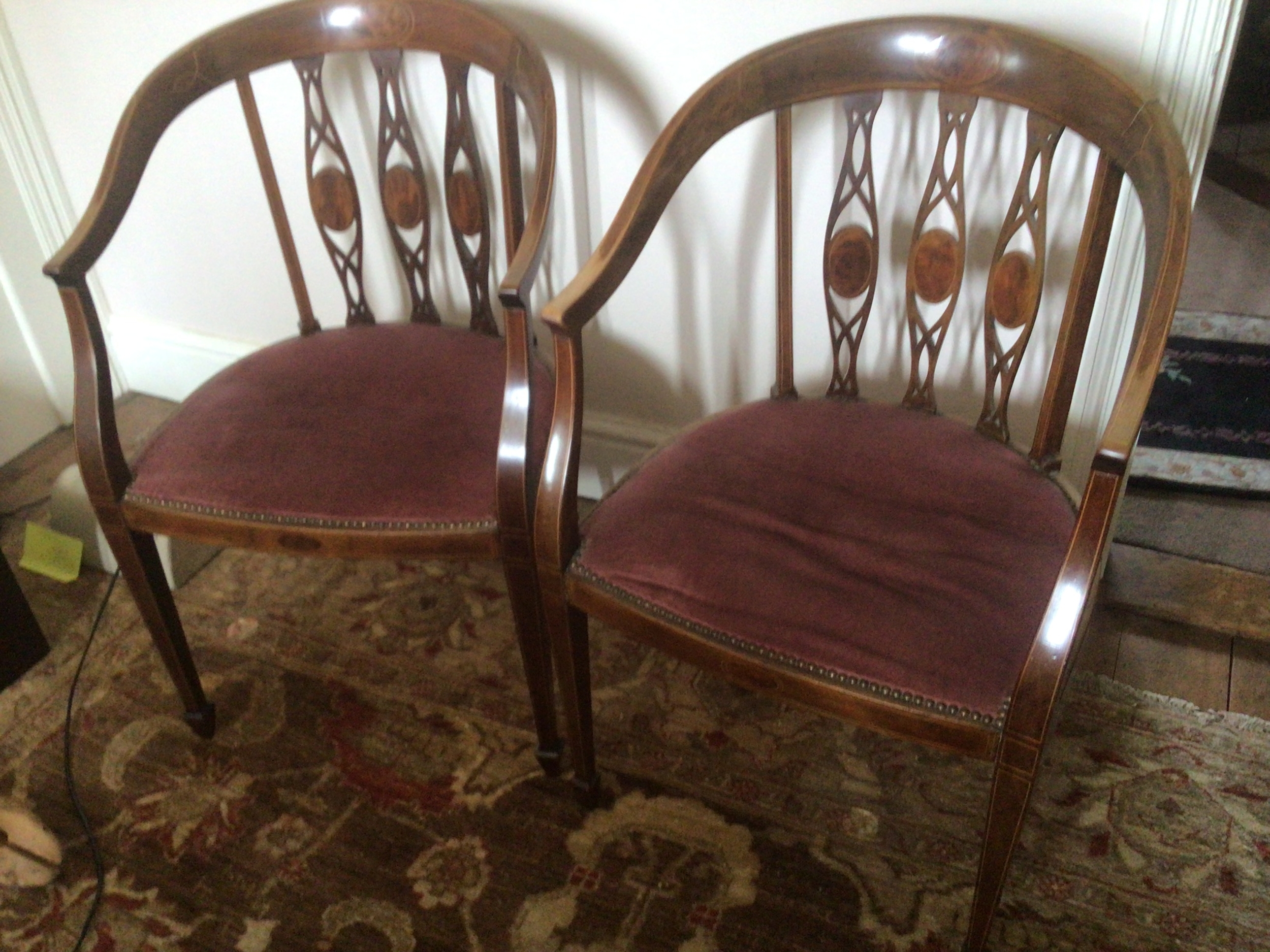  A Pair of Edwardian inlaid Mahogany chairs. With shaped backs. 