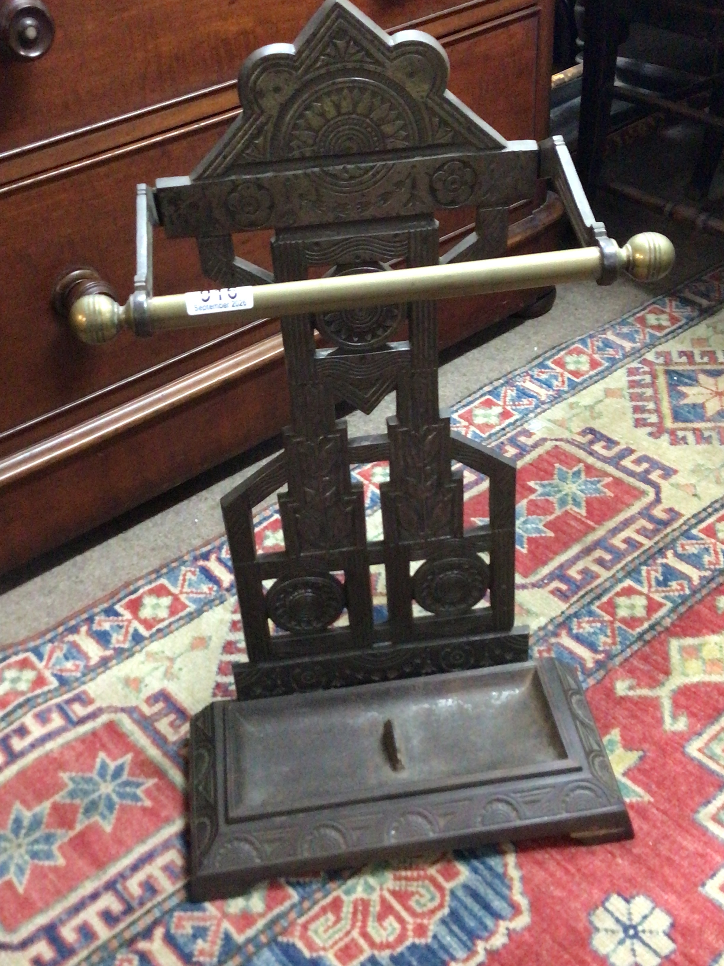  A quality Victorian cast iron and brass aesthetic influenced stick stand the reverse with Victorian lozenge stamp.  