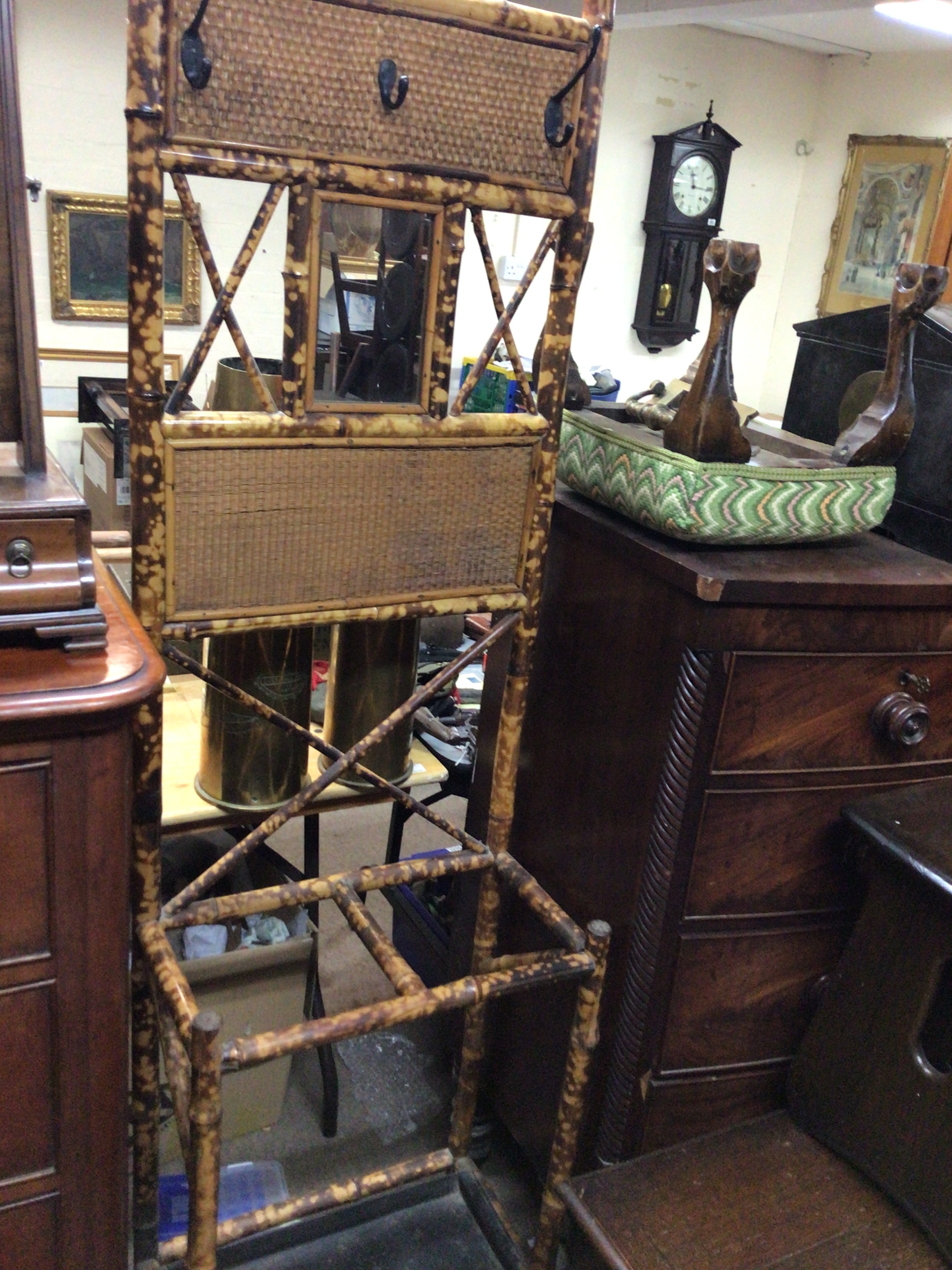  A Victorian Bamboo hall stand inset with a small mirror.