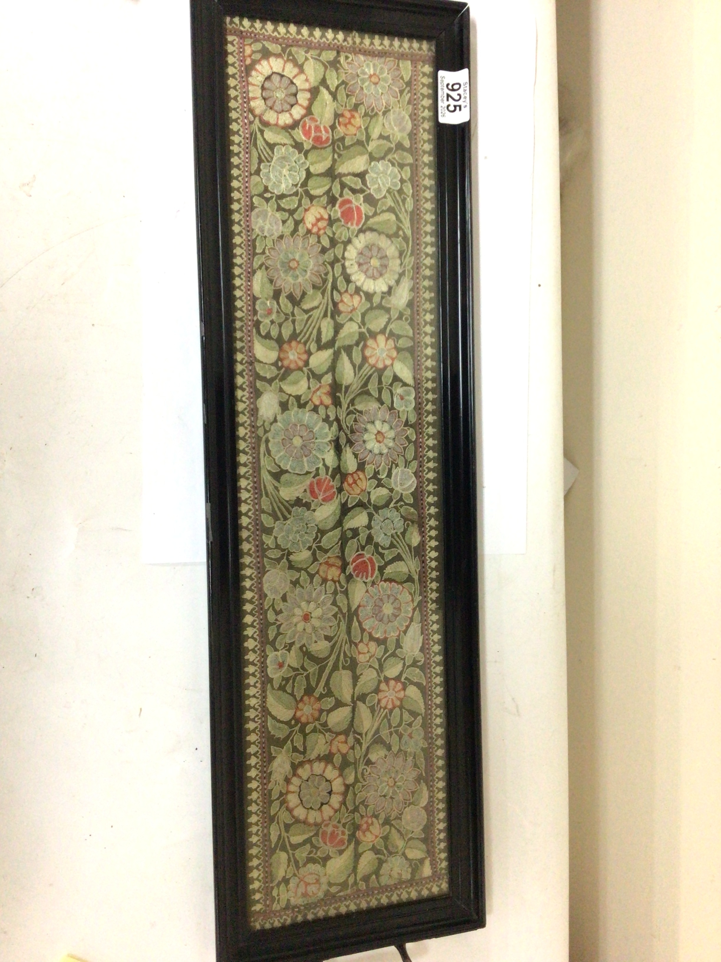 A Victorian tray incapsulating hand embroidered panels of  Arts and Crafts design 75cm long.