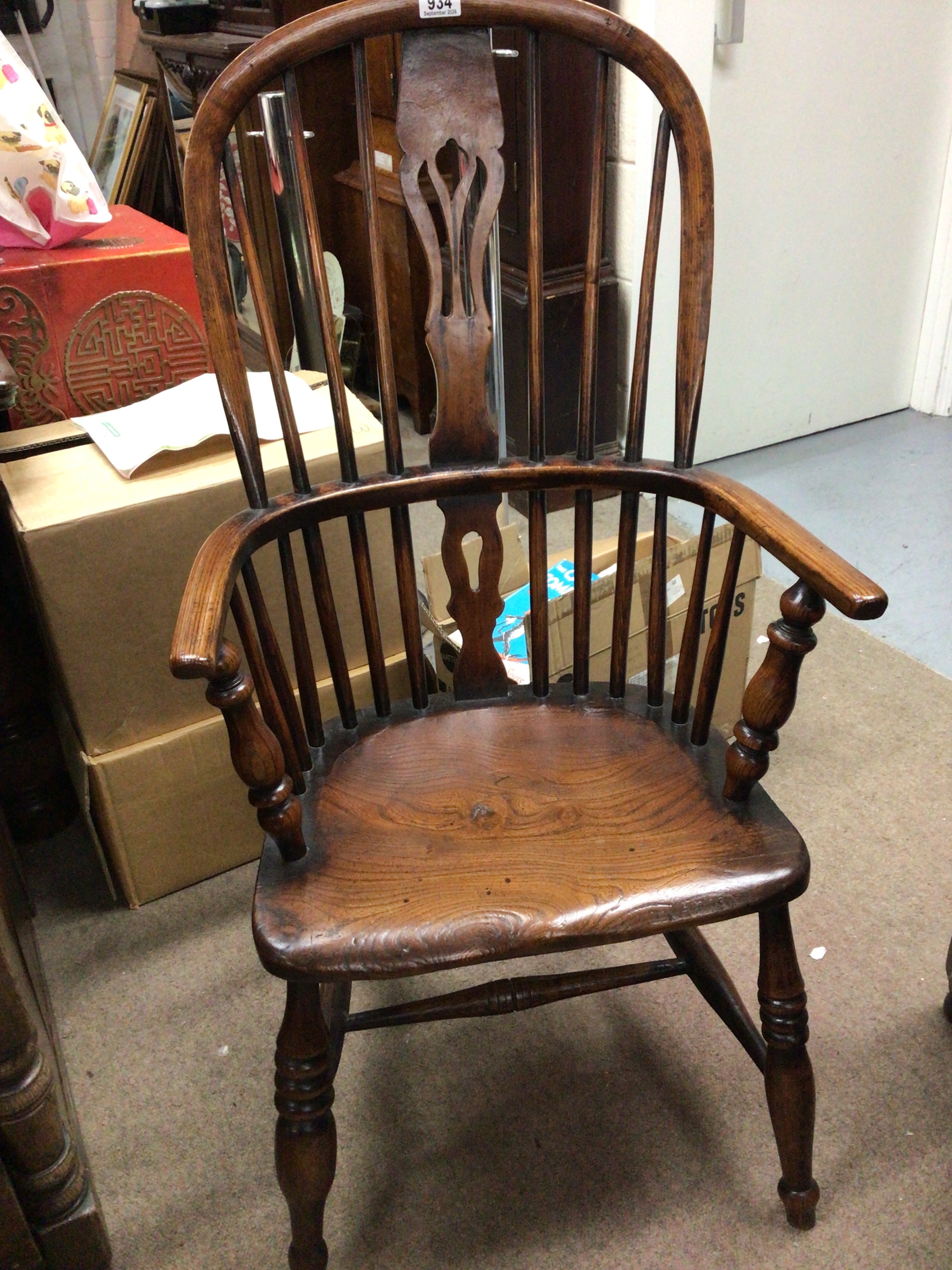 A quality early 19th century Elm Windsor chair with a solid seat and turn