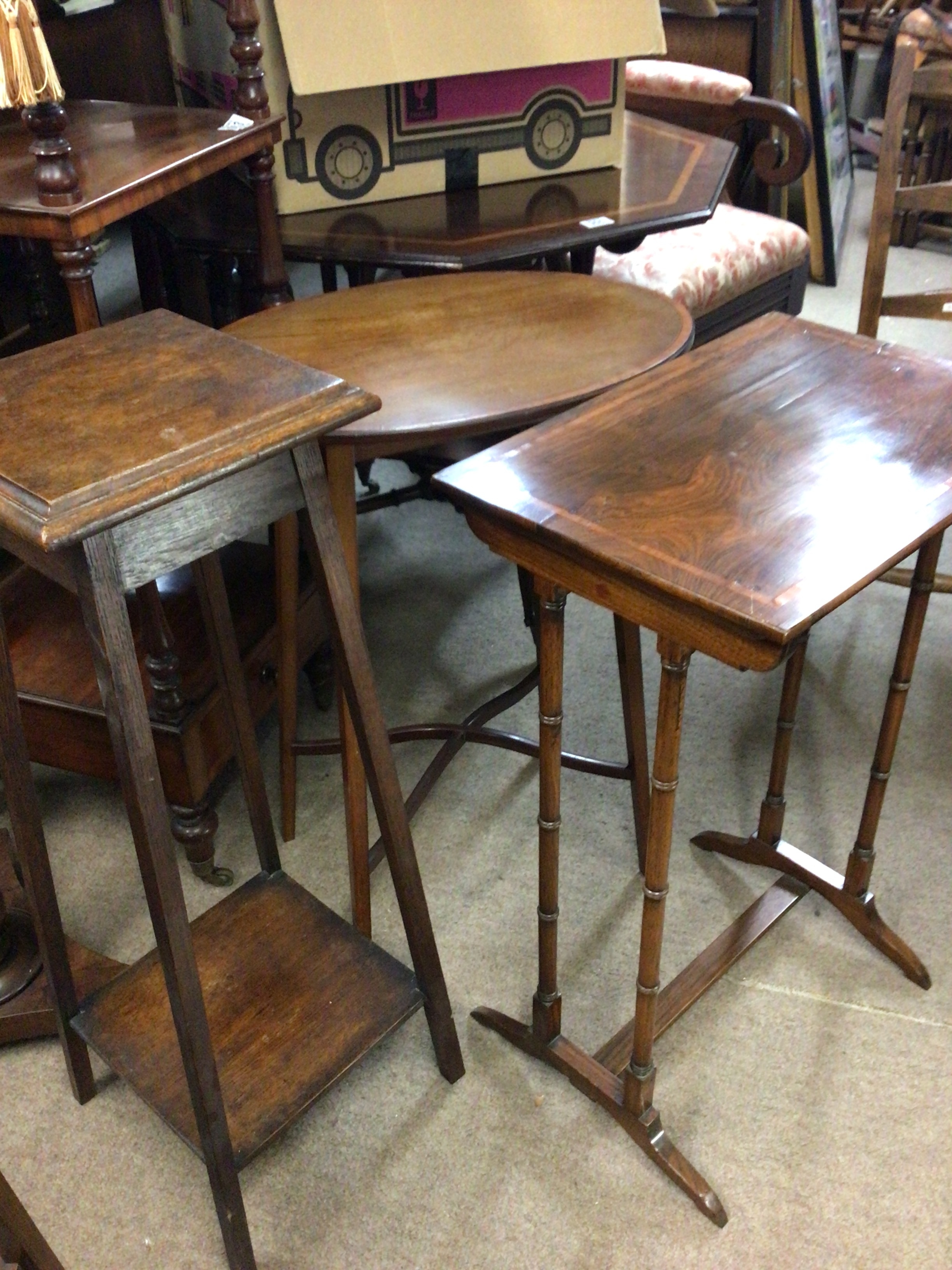 An oak stool with barley twist supports and other small furniture open shelves stools plant stands and others. 