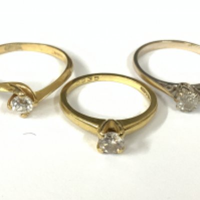 Three 18ct white gold diamond solitaires (x1 white gold). Approx ring size L,N,Q. Approx 7.3g. Postage category A
