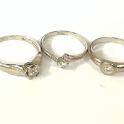 Three 9ct white gold diamond solitaire rings. Approx ring size K,M,N. Approx 6.2g. Postage category A