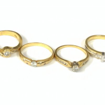 Four 18ct gold diamond solitaire rings with diamond shoulders. Approx ring size L,M,O. Approx 13.3g. Postage category A