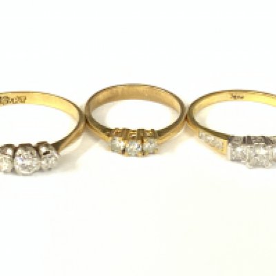 Three 18ct gold three stone diamond rings. Approx ring size G,N,Q. Approx 6.4g. Postage category A