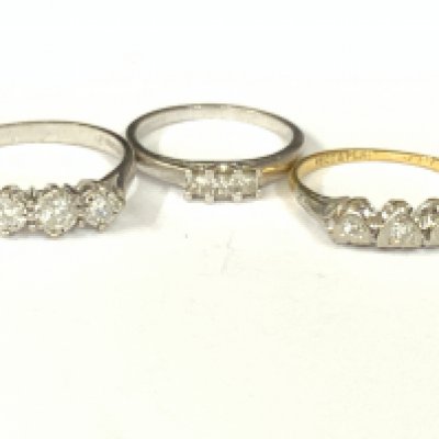 Three 18ct gold three stone diamond rings. Approx ring size K,M,O. Approx 8gm. Postage category A