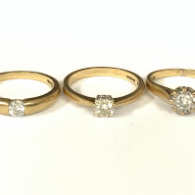 Three 9ct gold diamond solitaire rings. Approx ring size J,L,M. Approx 6.4g. Postage category A