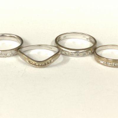 Four 18ct white gold diamond half hoop rings. Approx ring size I,K,N,L. Approx 8.9g. Postage category A