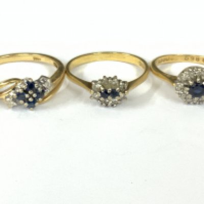 Three 18ct gold sapphire / diamond cluster rings. Approx ring size I,N,P. Approx 8.9g. Postage category A