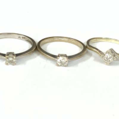 Three 9ct white gold diamond solitaire rings. Approx ring size K,M,O. Approx 5.4g. Postage category A