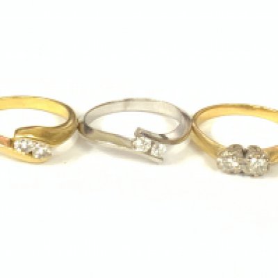 Theee 18ct gold two stone diamond rings (x1 white gold). Approx ring size M. Approx 11gm. Postage category A