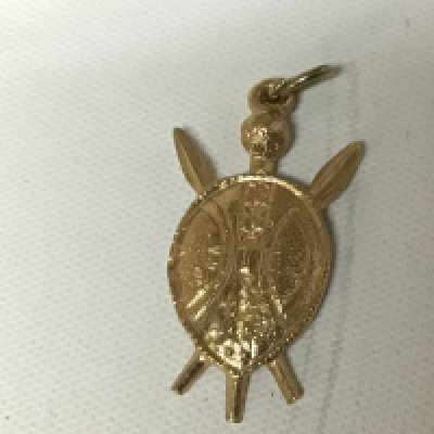 A Small 9carat gold shield shaped pendent. Weight 2.2g approximately