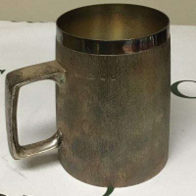 A Mid 20th Century modern design silver mug by Christopher Lawrence (b1936) Liveryman for the Worshipful Goldsmith Company Studied Central School of Arts & Crafts. The silver mug with a textured finish London hallmarks makers stamp very good condition weight 495g height 12cm