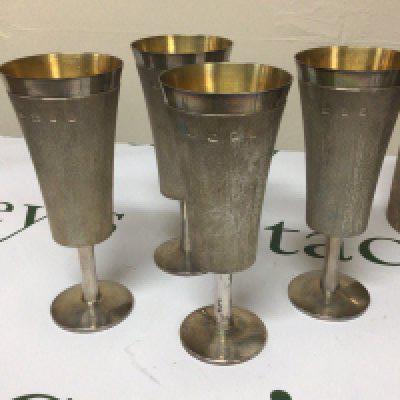 A set of four parcel guilt Silver mid 20th century design wine goblets on stems with circular foot by Christopher Lawrence (b1936) Liveryman for the Worshipful Goldsmith Company Studied Central School of Arts & Crafts. Weight 840g height 16cm