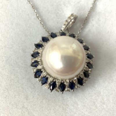 18ct white gold large pearl, diamond and sapphire pendant on an 18ct white gold chain, boxed. Marquise sapphires 1.96ct R/C diamonds 0.60ct. Postage category A