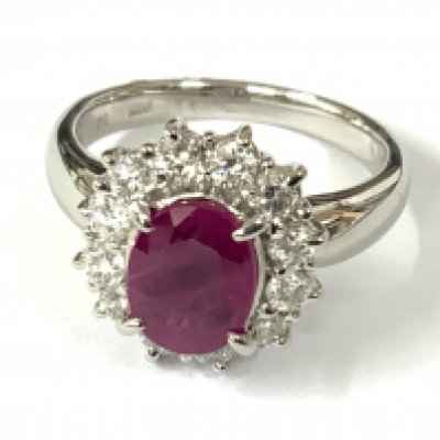 Platinum cluster ring set with an oval Burmese ruby surrounded by RBC diamonds. Ruby 1.60ct. Diamonds 0.58ct. Approx ring size K/L. Postage category A