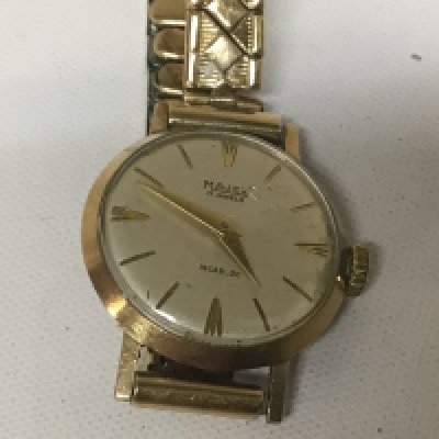 A ladies 9carat gold cased watch Majex with a gold plated strap.