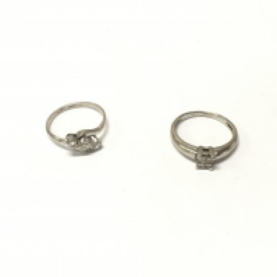 Two platinum diamond rings. Approx weight 6 grams, size K.
