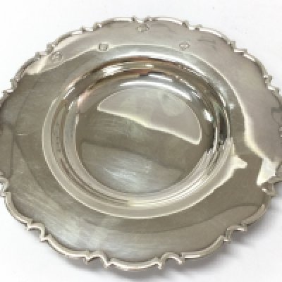 A small silver hallmarked dish. 10cm wide. Postage category A