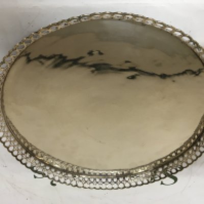 A Continental possible German white metal tray of circular shape with a pierced edge and feet. Marks to the reverse see image. 30cm diameter. 875g approximately.